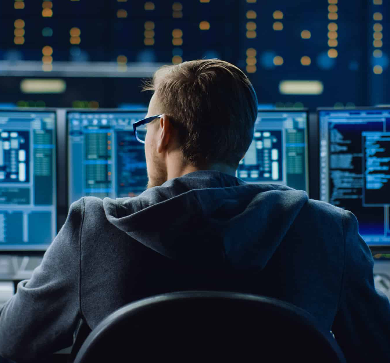 Person-Using-Three-Monitors-at-Desk-narrow
