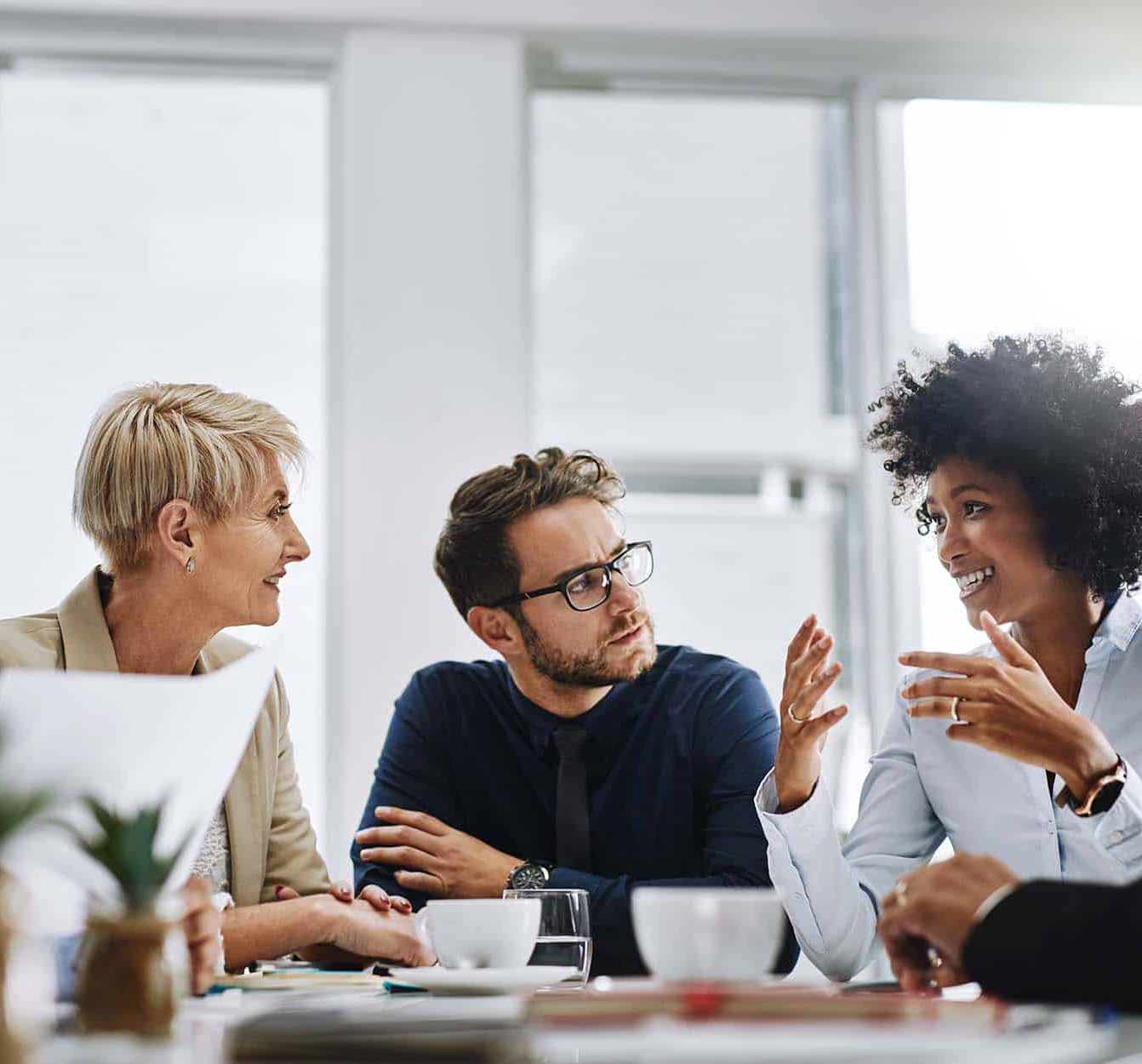 Team-of-Coworkers-in-Conference-Room-narrow