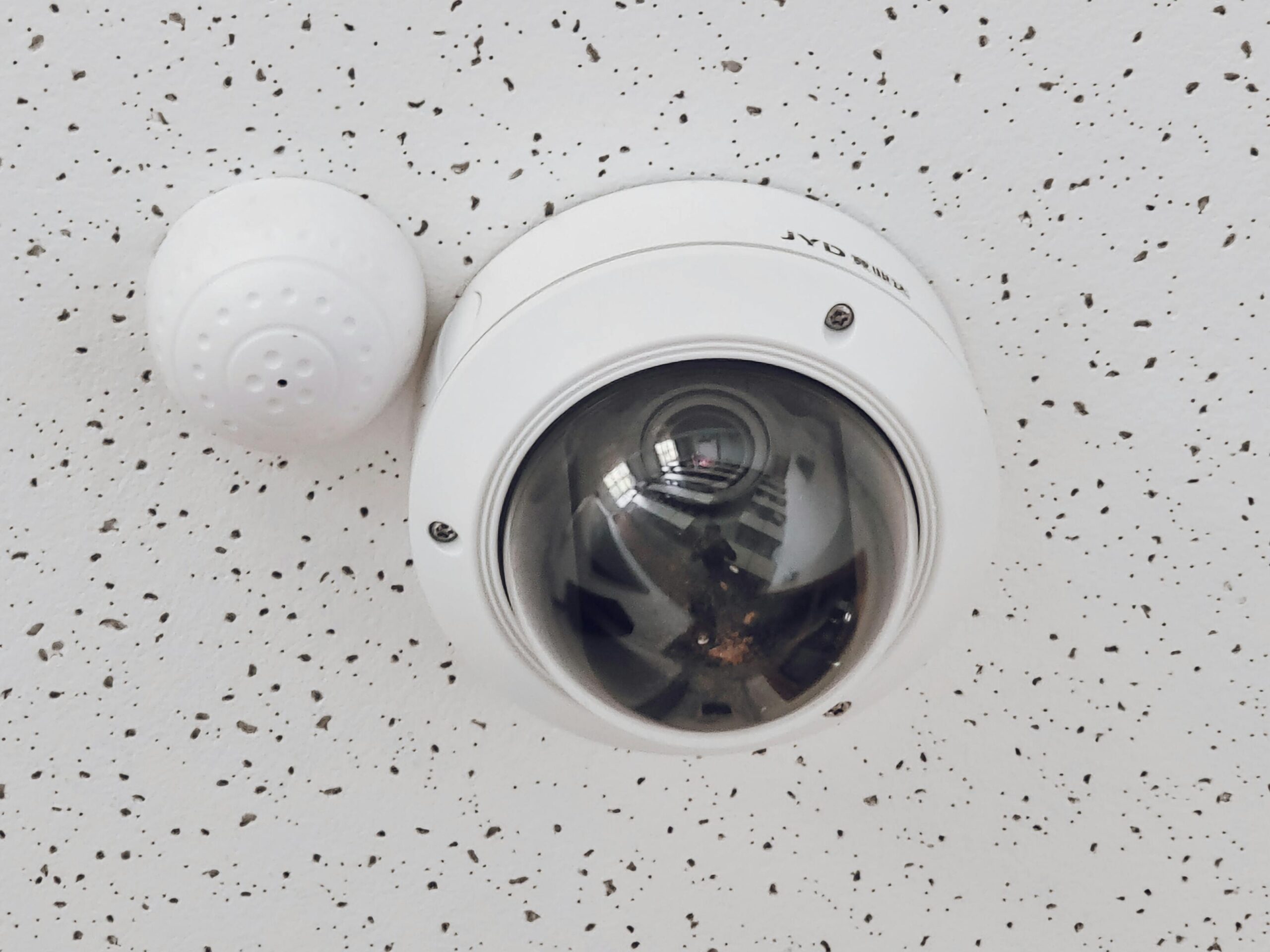 Indoor dome security camera installed in a Charlotte office